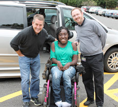 Doug Kimmelman, left, with Matheny student Raven Bennett and Matheny transportation manager Brad King in front of the Toyota Sienna donated by Kimmelman. 