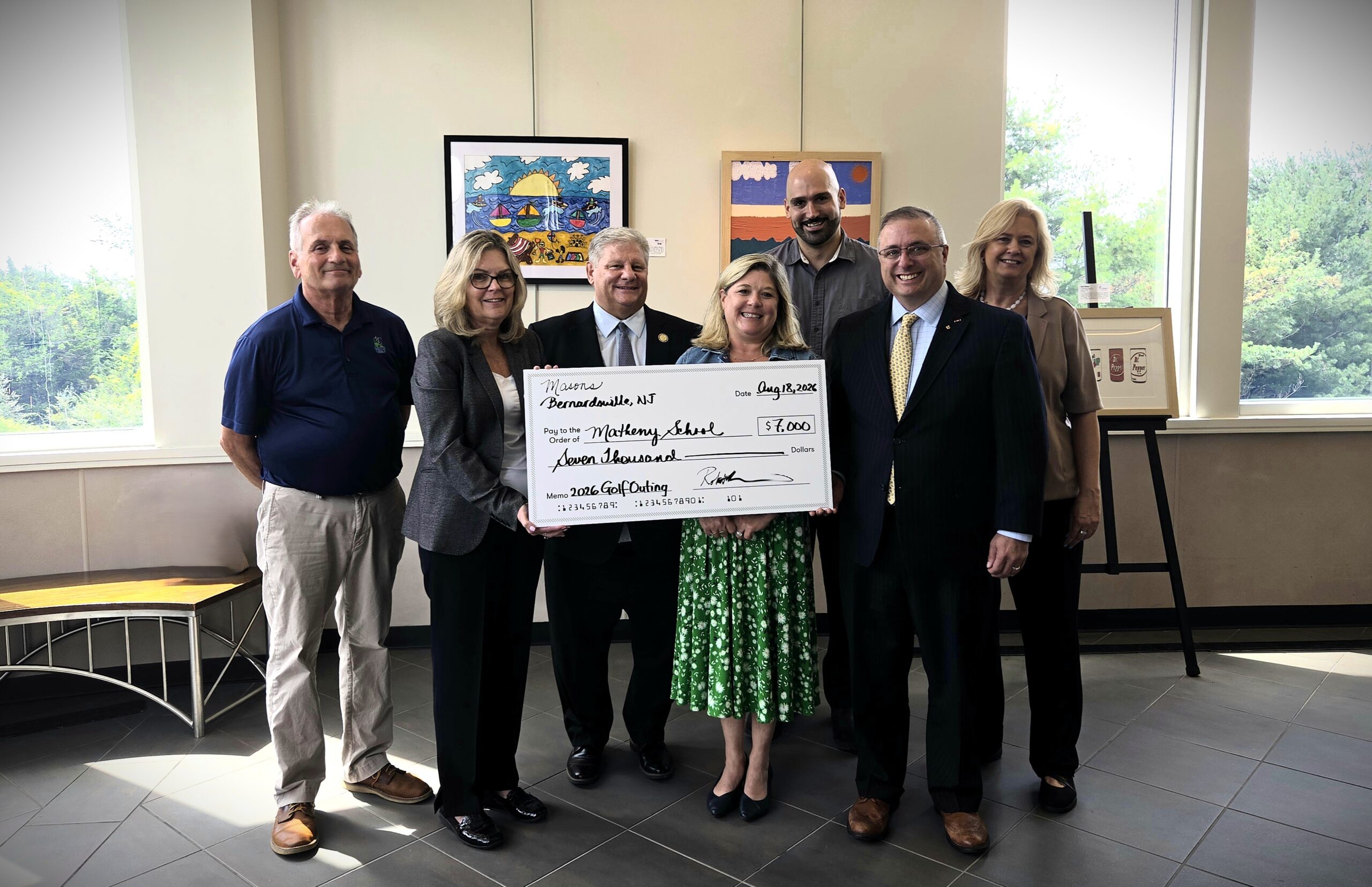 Congdon-Overlook Lodge members present check to Matheny Leadership.